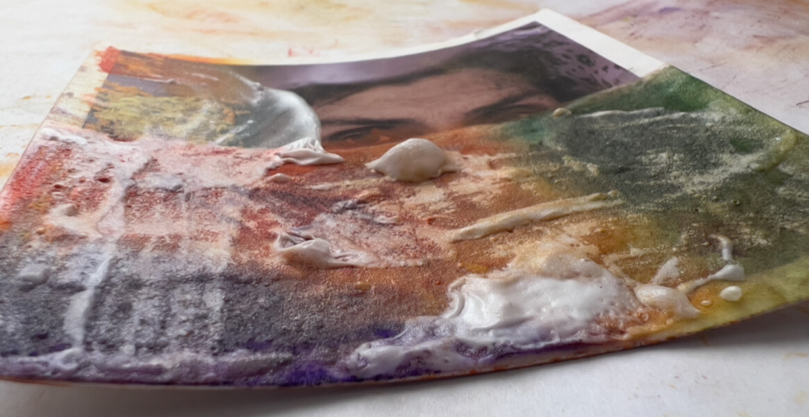 Texturized thick gesso on a test photo print, with thick pastel blended, more thick gesso textured, with bubbles.
