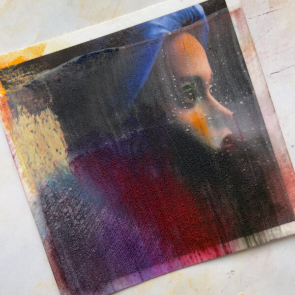 Experimenting with painting on photos: Texturized thin gesso on a test photo print, pastel applied, final gesso dry.