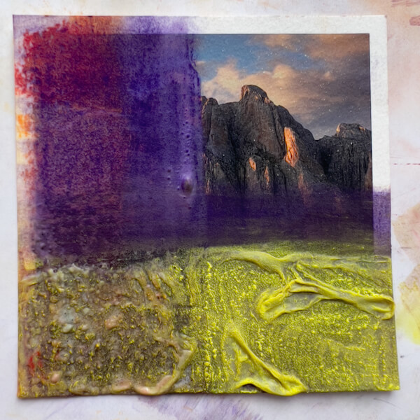 Experimenting with painting on photos: Textured, swirled, thick gesso over a photo print, final appearance.